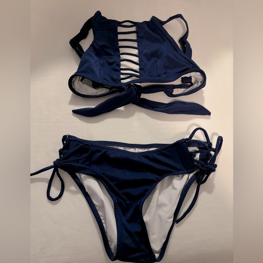 Adorable VENUS bikini. Good coverage on bottoms and cute cut out detail in top.